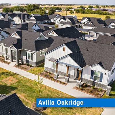 White and gray-colored, single family for rent homes surrounded by green grass.